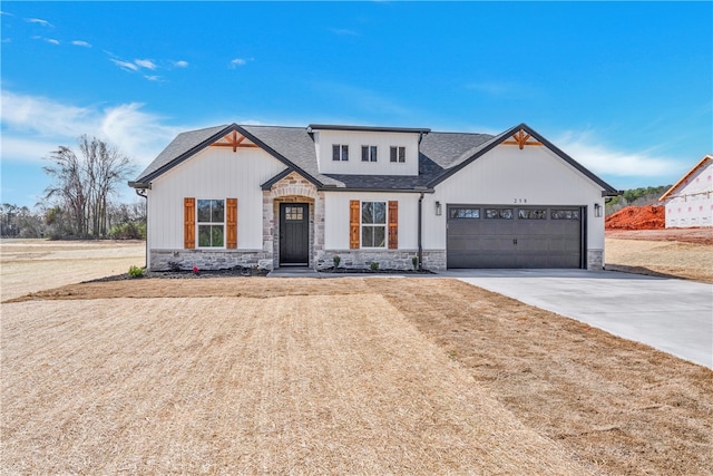 modern inspired farmhouse with a garage