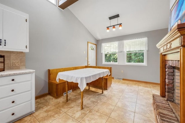286 Nostradamus Ct, Salem, SC 29676 - dining area with vaulted ceiling, a fireplace, and light tile patterned flooring