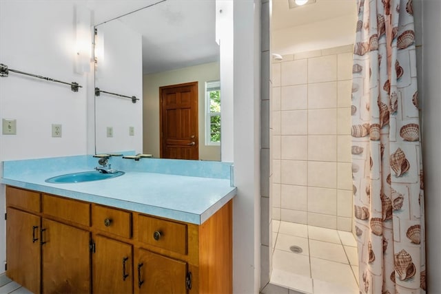 bathroom featuring tile patterned flooring, vanity, and a shower with curtain