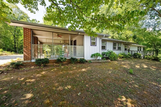 rear view of house with covered porch and ceiling fan