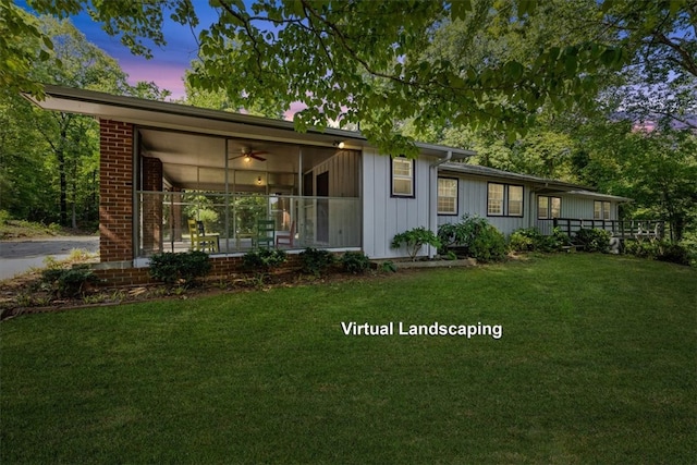 view of front of property featuring a yard and covered porch