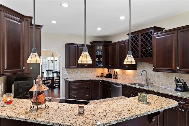 kitchen with dark brown cabinetry, dishwasher, sink, and pendant lighting