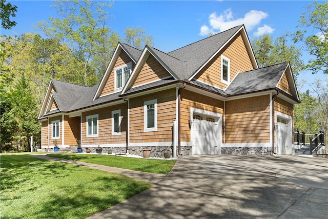 view of front of home featuring a garage and a front lawn