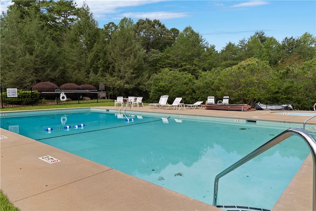 view of swimming pool featuring a patio