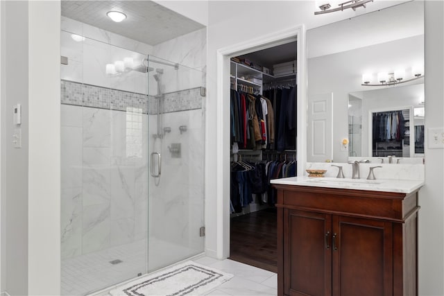 bathroom featuring vanity and walk in shower