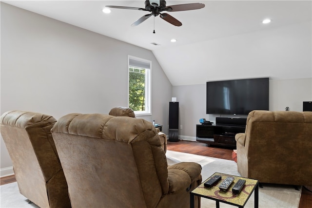 living room featuring ceiling fan, light wood-type flooring, and lofted ceiling