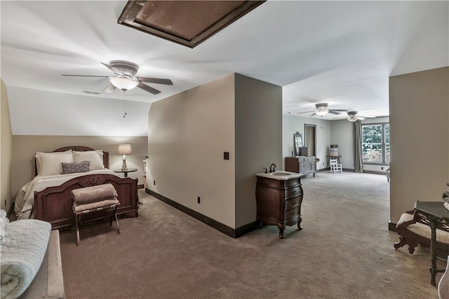 carpeted bedroom with sink and ceiling fan