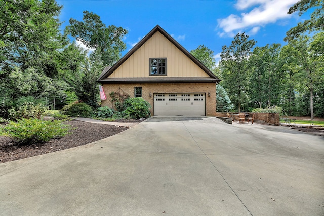 view of side of property featuring a garage