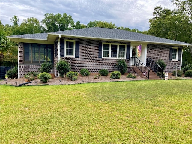 ranch-style home featuring a front yard