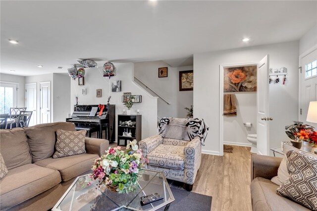 living room featuring plenty of natural light and light hardwood / wood-style floors