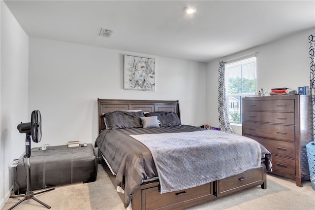 bedroom featuring light carpet