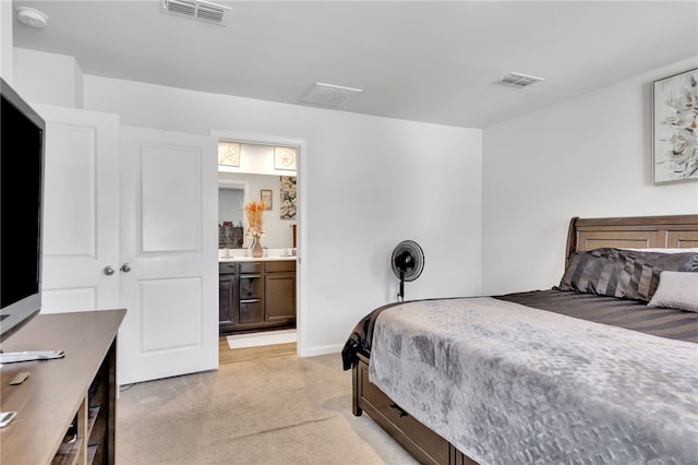 carpeted bedroom with ensuite bathroom