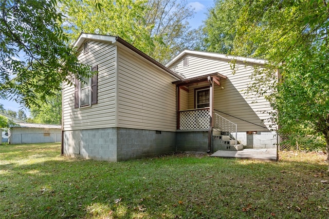 exterior space with a front lawn and a patio area