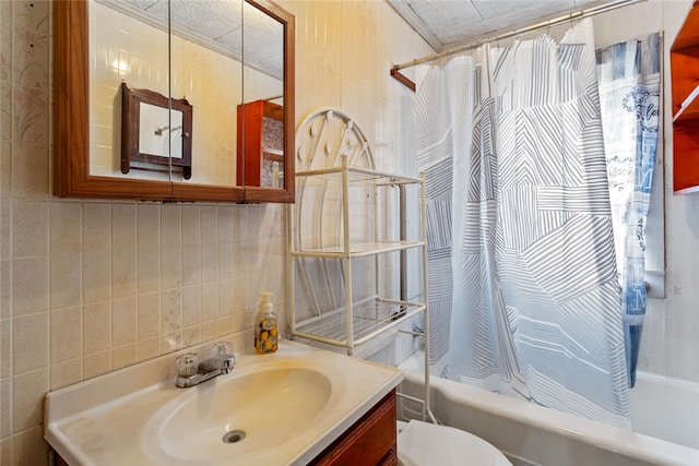 full bathroom featuring tile walls, shower / tub combo with curtain, and vanity