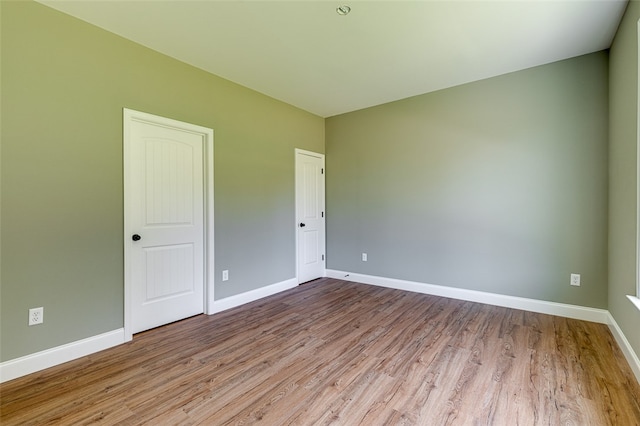 unfurnished room featuring light hardwood / wood-style floors