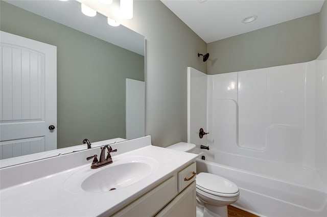 full bathroom with shower / bathtub combination, vanity, and toilet