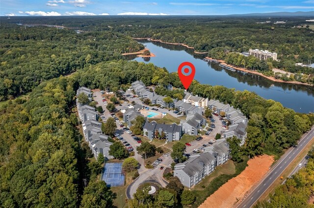 bird's eye view with a residential view, a water view, and a view of trees