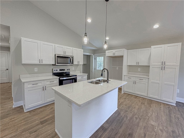 kitchen with white cabinets, appliances with stainless steel finishes, and sink