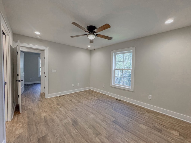 empty room featuring light hardwood / wood-style flooring and ceiling fan