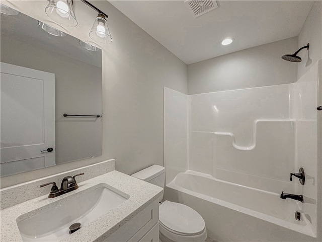 full bathroom with bathing tub / shower combination, vanity, and toilet