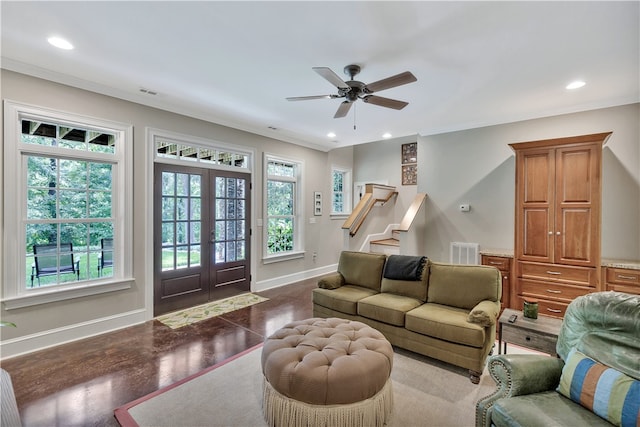 living room featuring ornamental molding, plenty of natural light, and hardwood / wood-style floors