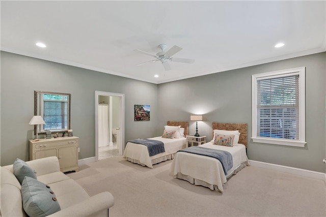 carpeted bedroom featuring ceiling fan, connected bathroom, and ornamental molding