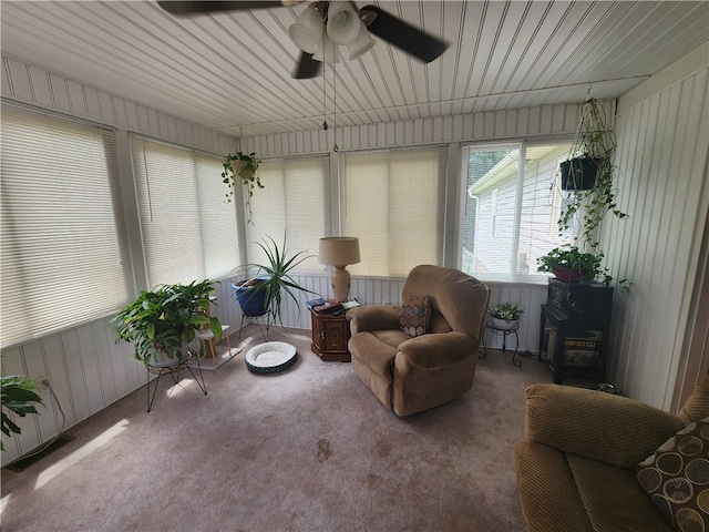 sunroom featuring ceiling fan