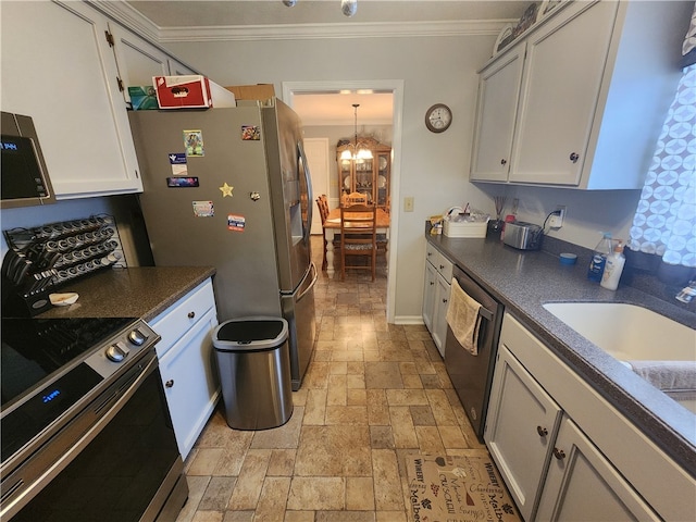 kitchen featuring ornamental molding, a chandelier, stainless steel appliances, and white cabinets