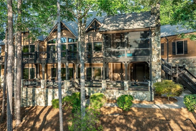606 Majesty Ct, Salem, SC 29676 - exterior space with a balcony, stairs, a sunroom, and stone siding