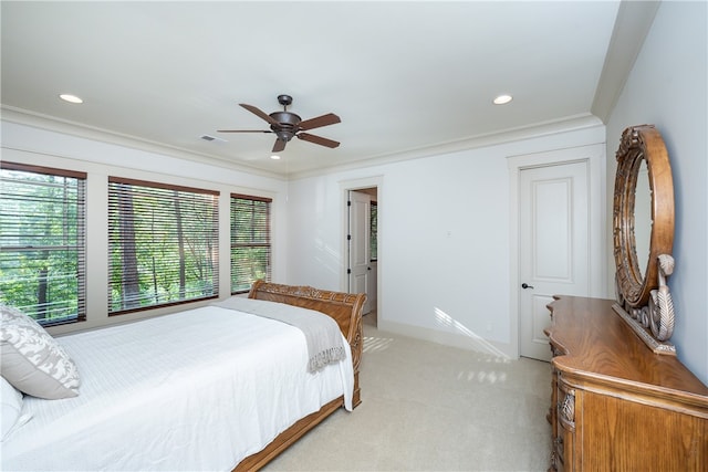 bedroom featuring crown molding, light carpet, and ceiling fan