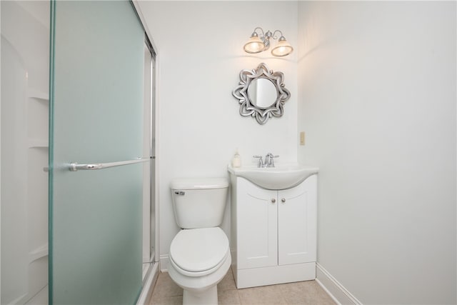 bathroom featuring vanity, tile patterned flooring, toilet, and a shower with door