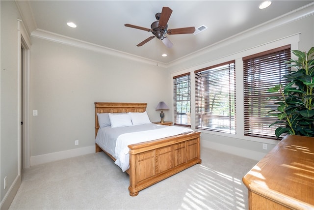 bedroom with ceiling fan, light colored carpet, and ornamental molding