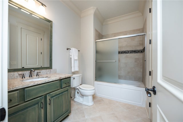 full bathroom with tile patterned floors, ornamental molding, enclosed tub / shower combo, vanity, and toilet