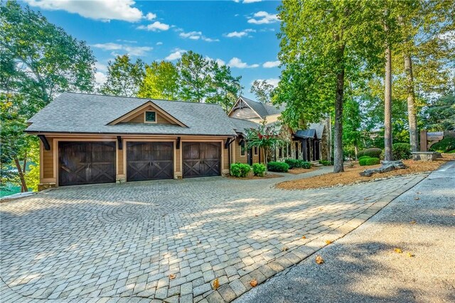 606 Majesty Ct, Salem, SC 29676 - view of front of house with decorative driveway, a shingled roof, and a garage