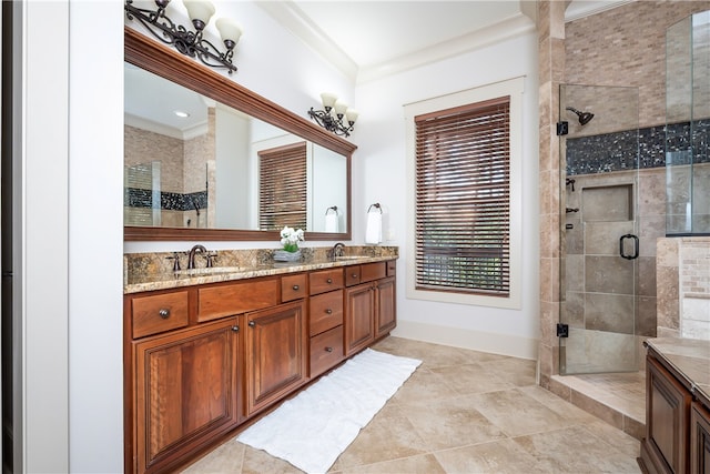 bathroom with vanity, crown molding, and an enclosed shower