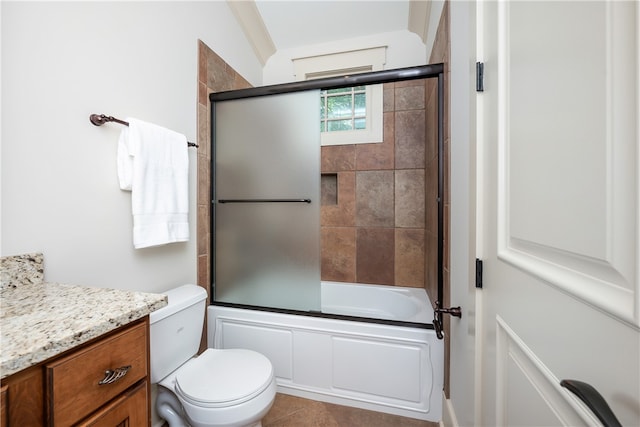 full bathroom with vanity, toilet, combined bath / shower with glass door, and tile patterned floors