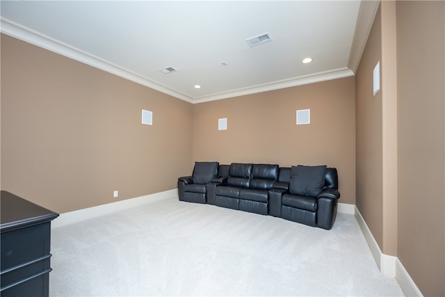 cinema with crown molding and light colored carpet