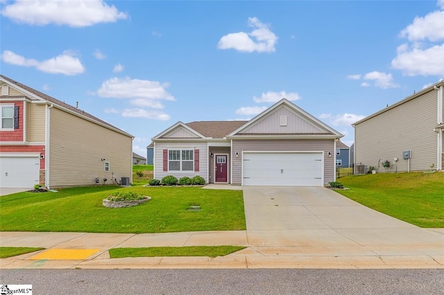 view of front of property with central AC, a front lawn, and a garage