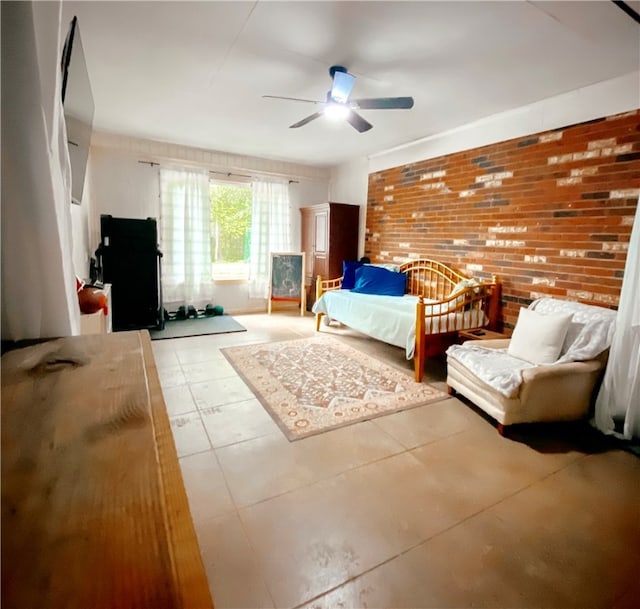 tiled bedroom featuring ceiling fan