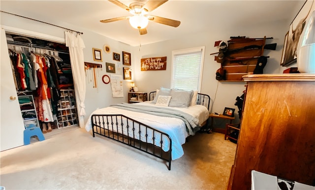 bedroom with carpet floors, ceiling fan, and a closet