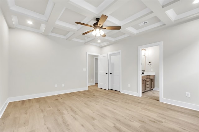 unfurnished bedroom with coffered ceiling, connected bathroom, beam ceiling, ceiling fan, and light hardwood / wood-style flooring