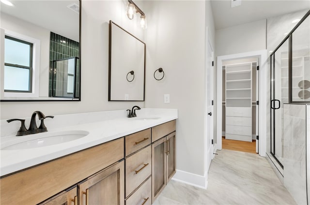 bathroom featuring vanity, a baseboard radiator, and an enclosed shower