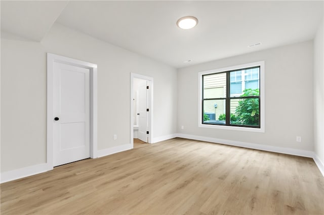 unfurnished room featuring light hardwood / wood-style flooring