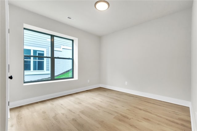 unfurnished room featuring light wood-type flooring