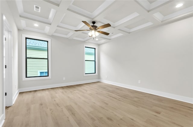 empty room with light hardwood / wood-style flooring, beam ceiling, ceiling fan, and coffered ceiling