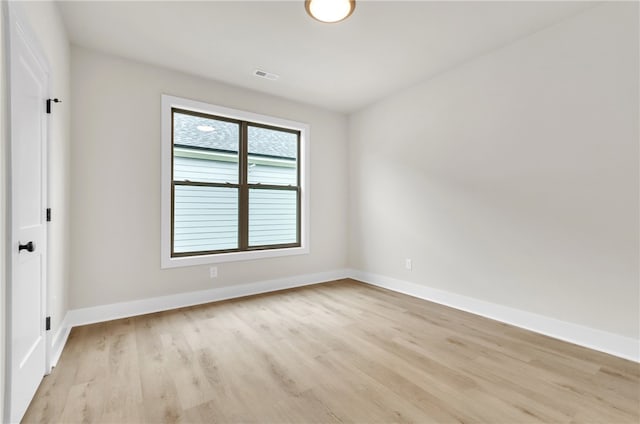 empty room with light wood-type flooring