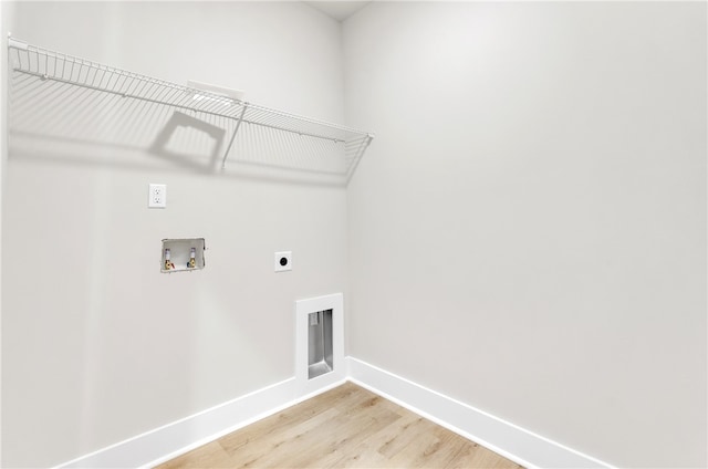 laundry area featuring light hardwood / wood-style flooring, electric dryer hookup, and washer hookup