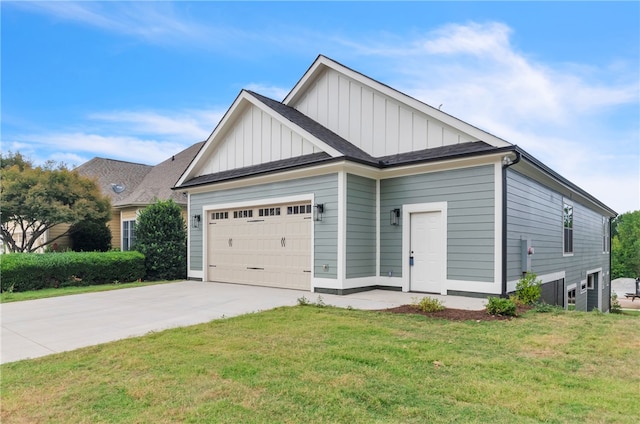 view of front of house with a front yard and a garage