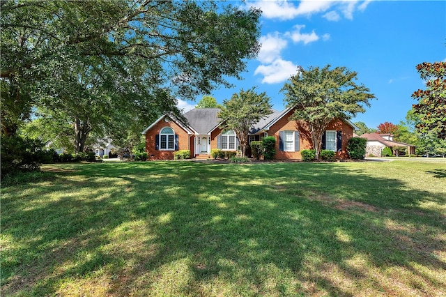 single story home featuring a front yard