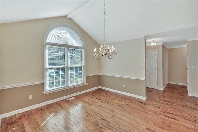 unfurnished room featuring light hardwood / wood-style floors, lofted ceiling with beams, and a chandelier